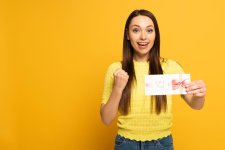 stock-photo-happy-woman-holding-gift-card.jpg