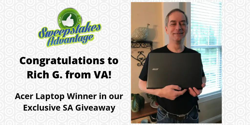 rich holding his new laptop prize