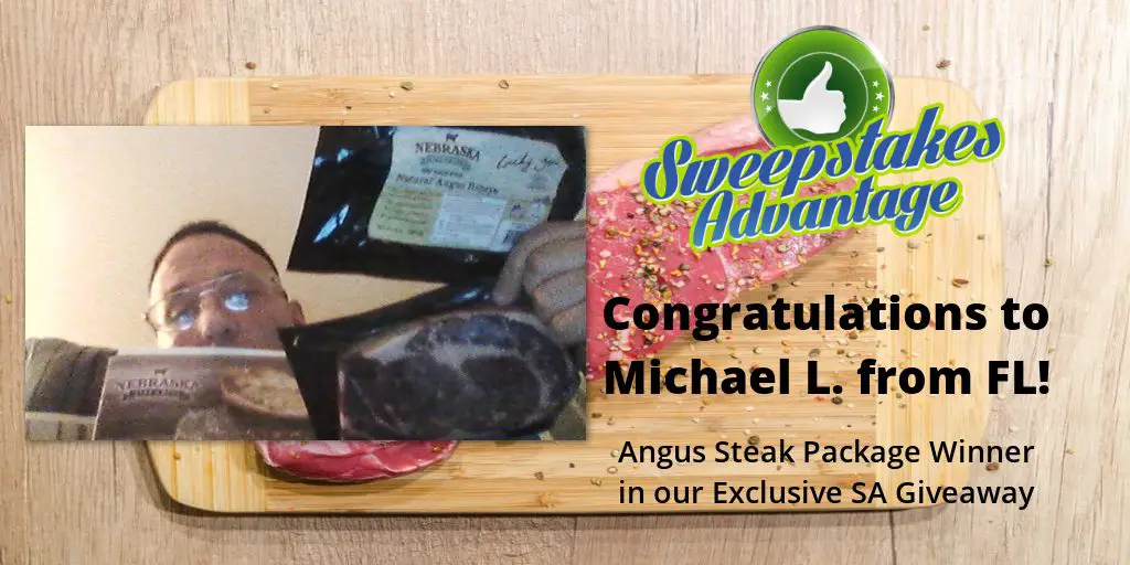 pictiue of Michael holding his steak sweepstakes prize