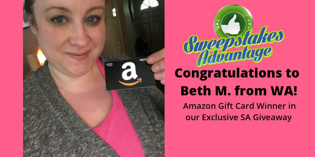 Beth holding gift card prize