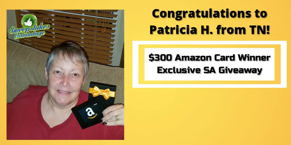 Patricia holding her gift card prize